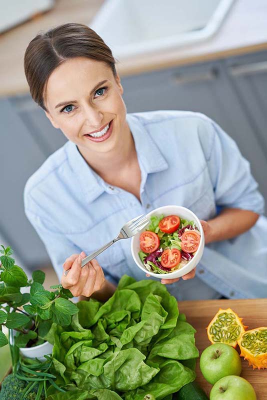 Healthy nutritionist, dietician, dietitian with green food.